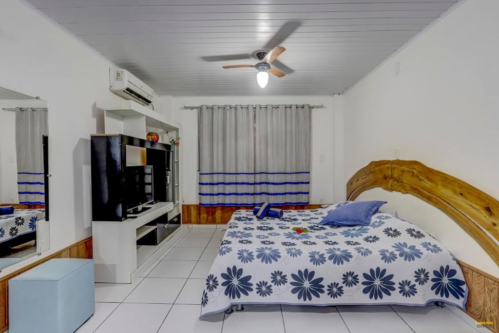 Cama ou camas em um quarto em Pousada Residenzial Cariocare