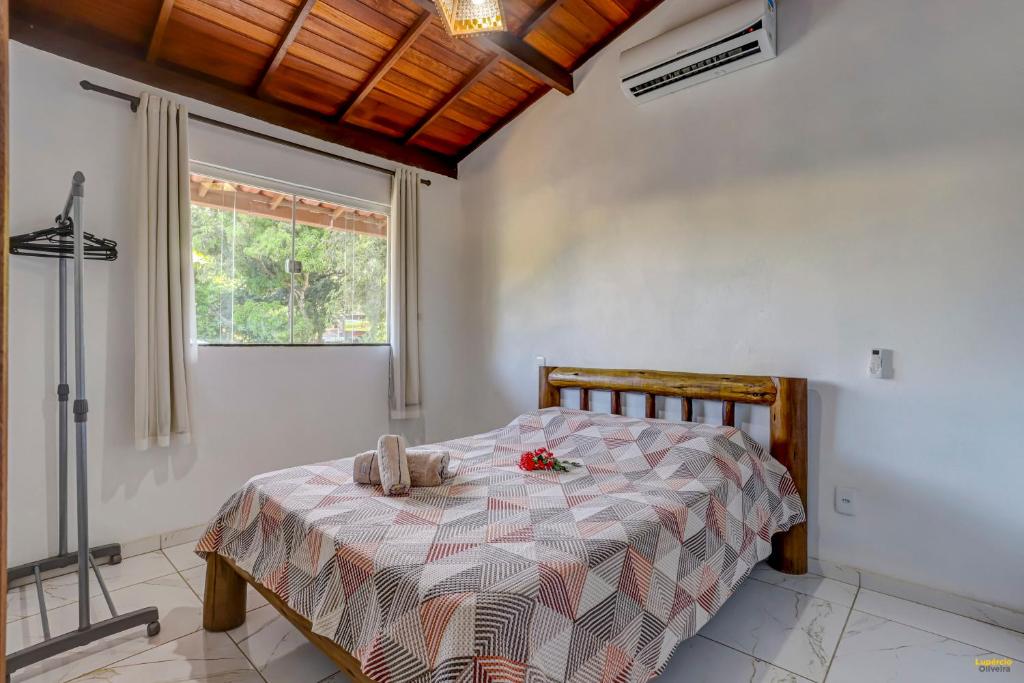 Cama ou camas em um quarto em Pousada Residenzial Cariocare