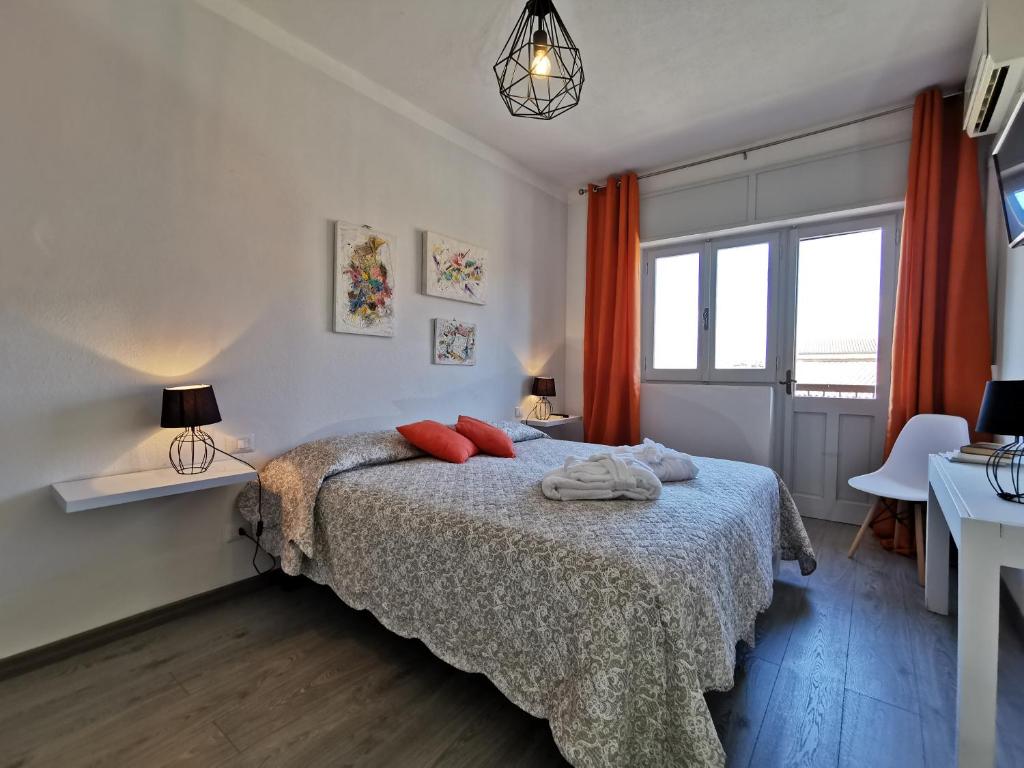 A bed or beds in a room at Samarò - Bed & Breakfast
