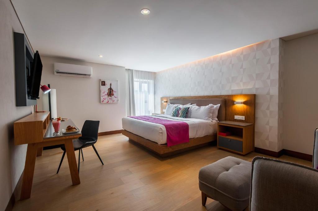 Postel nebo postele na pokoji v ubytování FCH Hotel Providencia