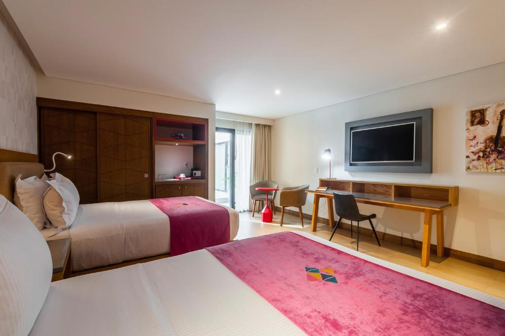 TV a/nebo společenská místnost v ubytování FCH Hotel Providencia