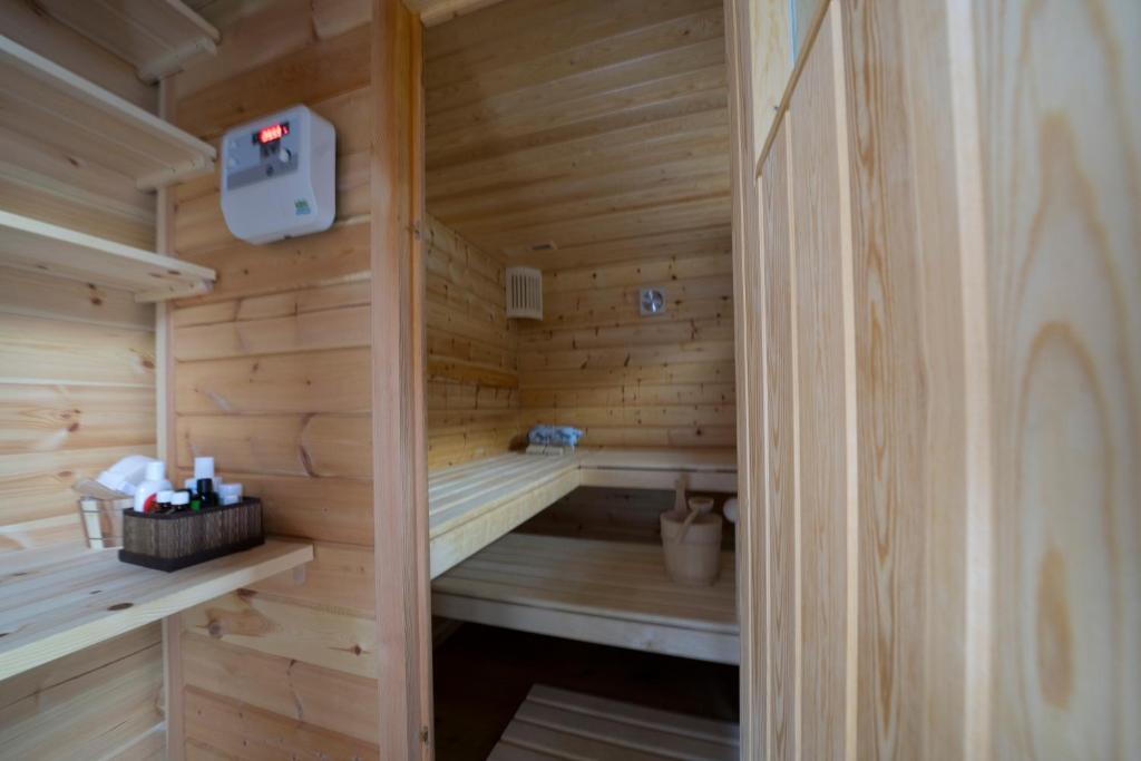 a wooden sauna with wooden walls and wooden floors at Stadel Ritz in Niederwald