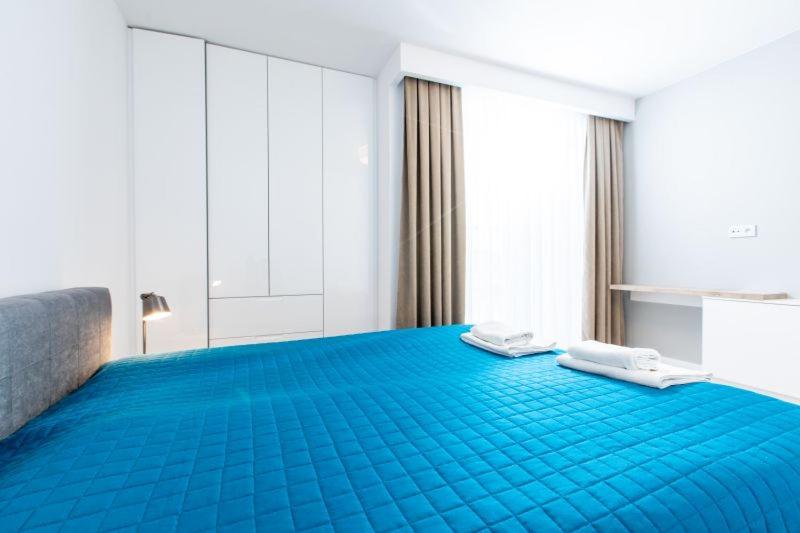 Postel nebo postele na pokoji v ubytování Resort Apartamenty Klifowa Rewal 30