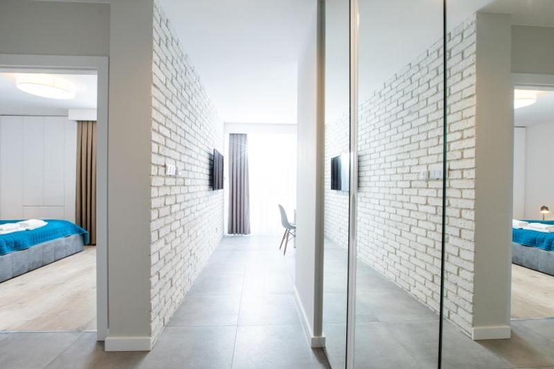 Postel nebo postele na pokoji v ubytování Resort Apartamenty Klifowa Rewal 30