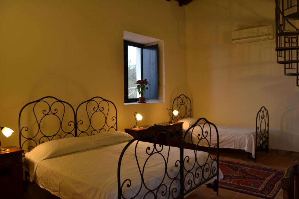 Postelja oz. postelje v sobi nastanitve Intero alloggio - Casale a Sant'Alfio immerso nel verde