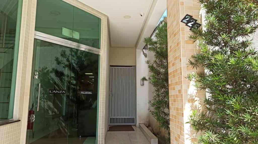 an entrance to a building with a glass door at Lotus Apartamentos in Santarém