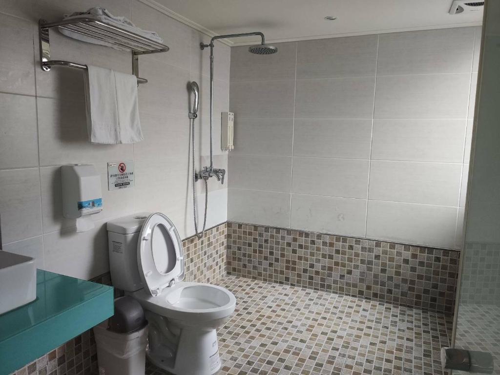 Koupelna v ubytování HengChang Business Hotel
