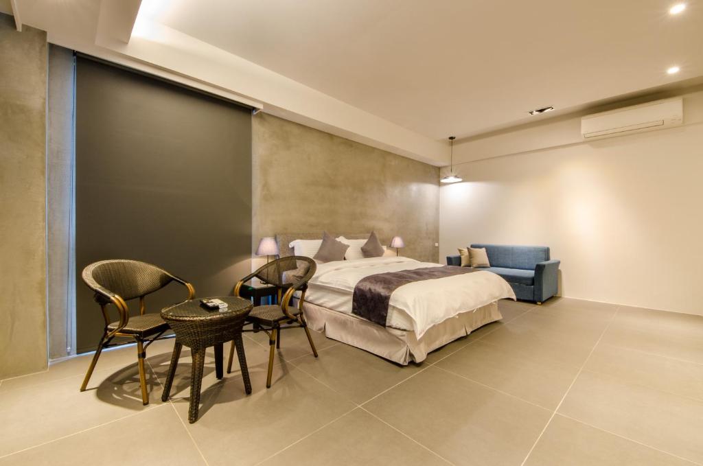 Postel nebo postele na pokoji v ubytování 礁溪320山館 Jiaoxi Shanguan B&B