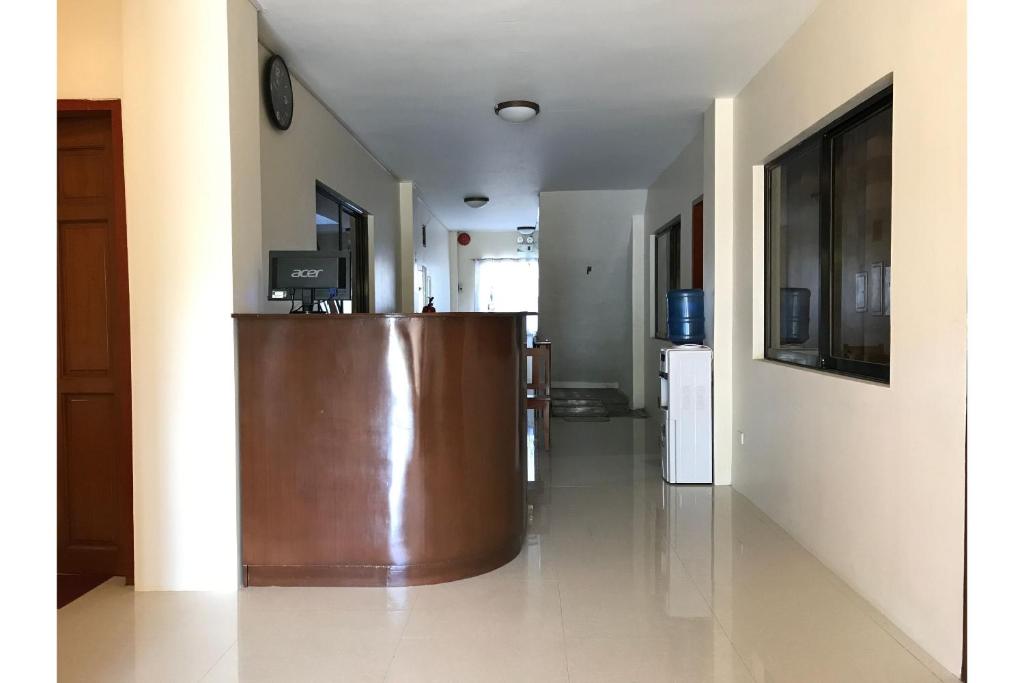 a lobby with a podium in the middle of a building at OYO 601 Guest Hotel in Naga