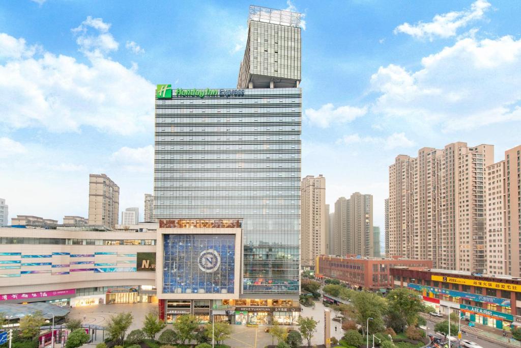 a tall building in a large city with tall buildings at Holiday Inn Express Changzhou Lanling, an IHG Hotel in Changzhou