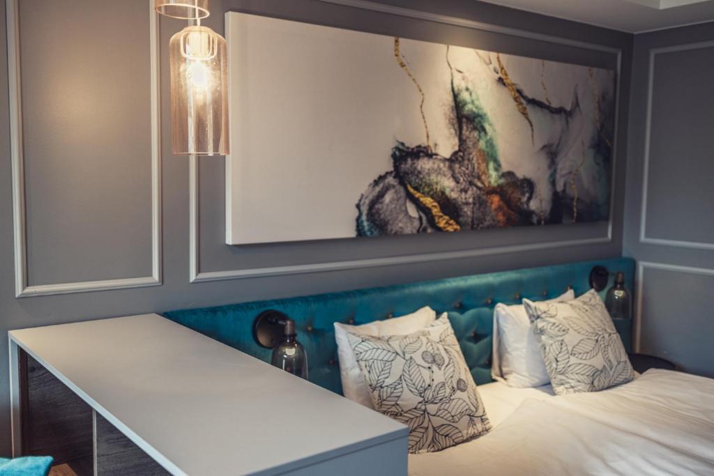 Postel nebo postele na pokoji v ubytování Hotel Poseidon
