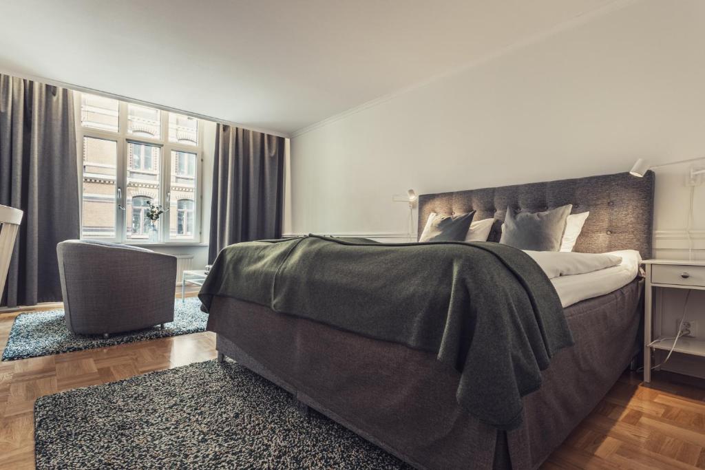 Postel nebo postele na pokoji v ubytování Hotel Poseidon