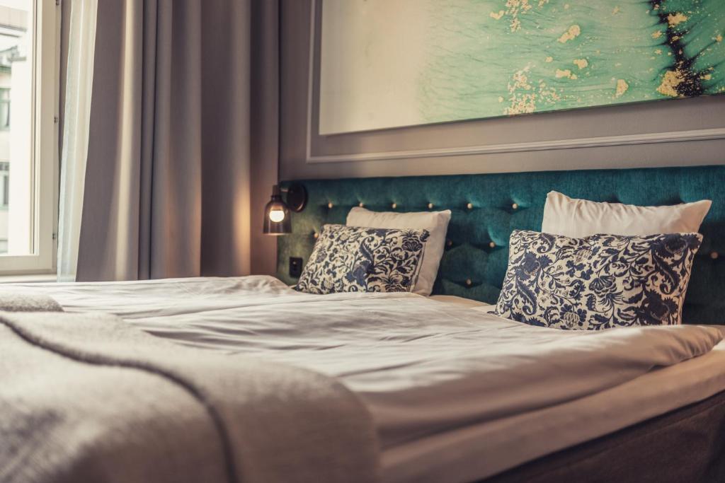 Postel nebo postele na pokoji v ubytování Hotel Poseidon