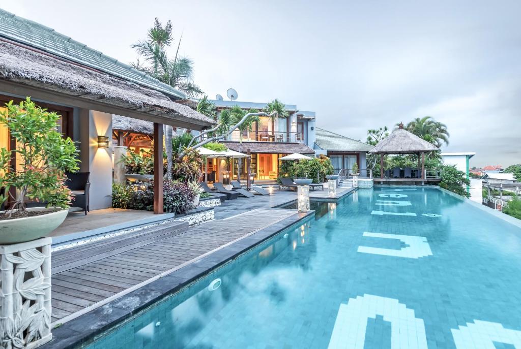 an image of a swimming pool at a villa at Hening Jimbaran in Jimbaran