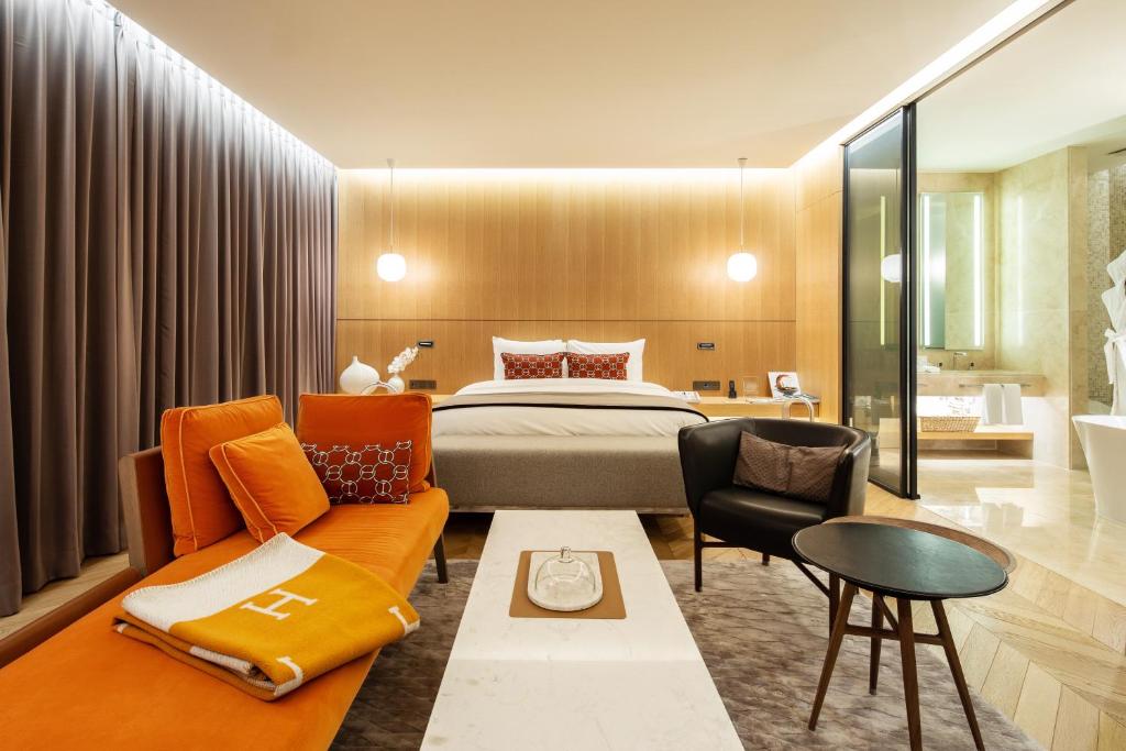 a hotel room with a bed and a couch at Hotel28 Myeongdong in Seoul