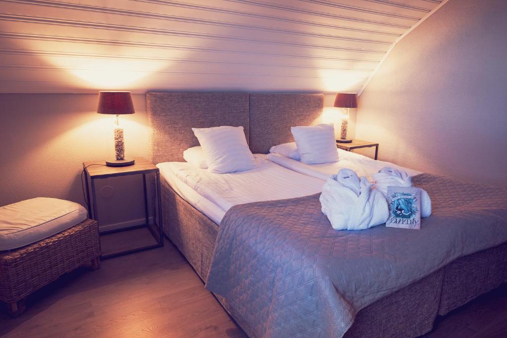 Postel nebo postele na pokoji v ubytování Hotell Mossbylund