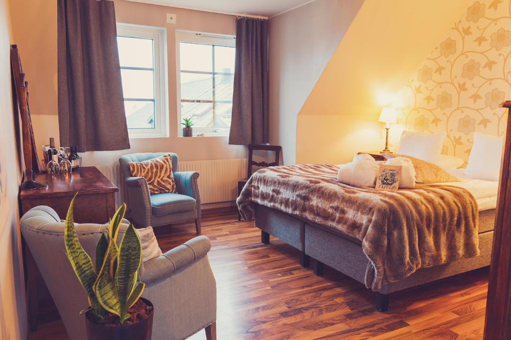 Postel nebo postele na pokoji v ubytování Hotell Mossbylund