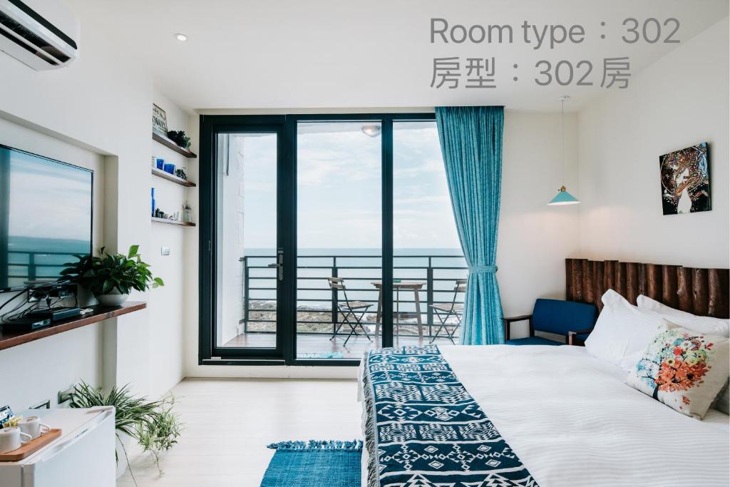 Postel nebo postele na pokoji v ubytování Chuanfanrock Haku Beach Days Inn