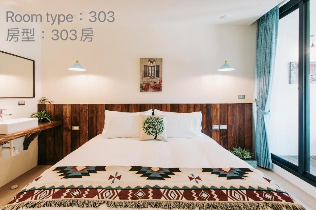 Postel nebo postele na pokoji v ubytování Chuanfanrock Haku Beach Days Inn