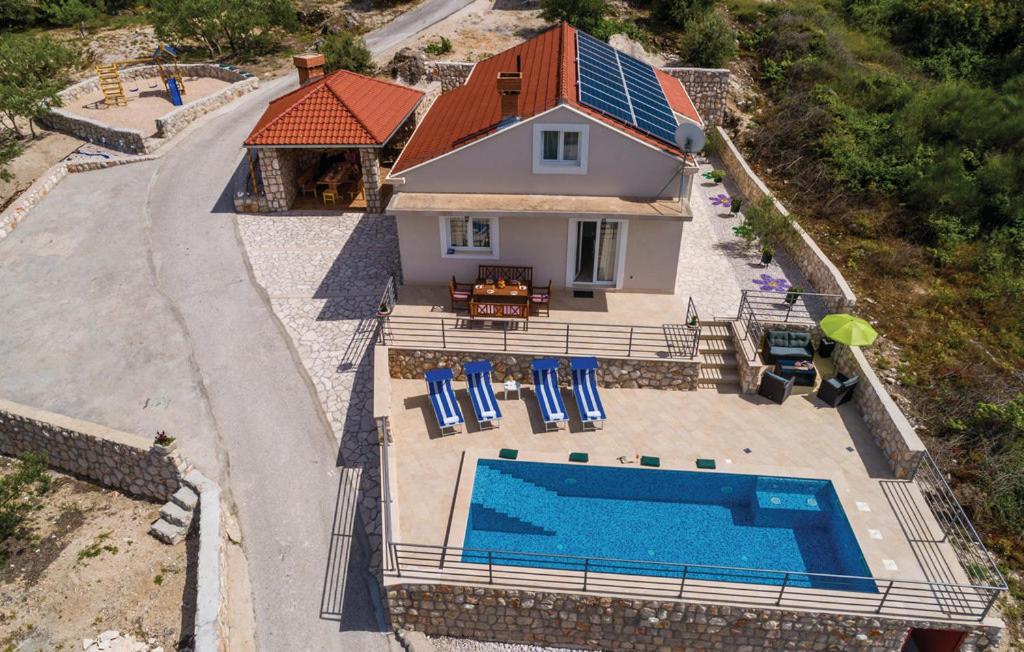an aerial view of a house with a swimming pool at Matušić Guest House in Dubrovnik