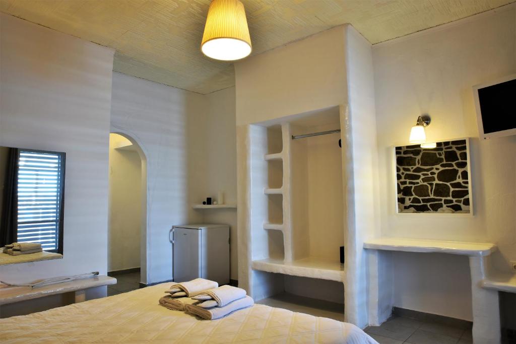 Postel nebo postele na pokoji v ubytování Adamas Hotel