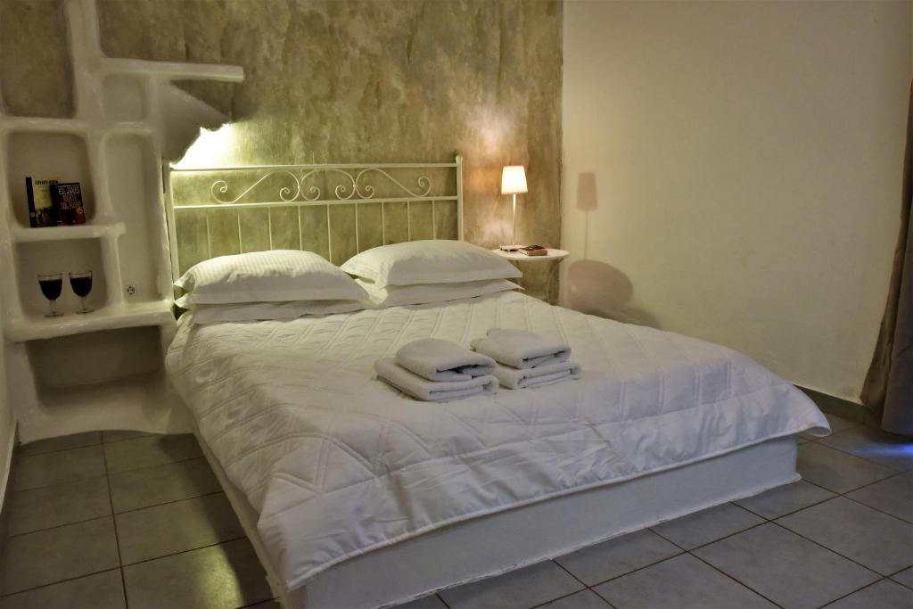 Postel nebo postele na pokoji v ubytování Adamas Hotel