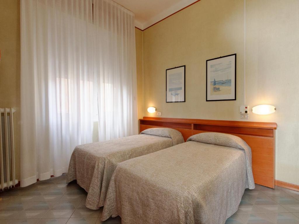Кровать или кровати в номере Hotel Ravenna