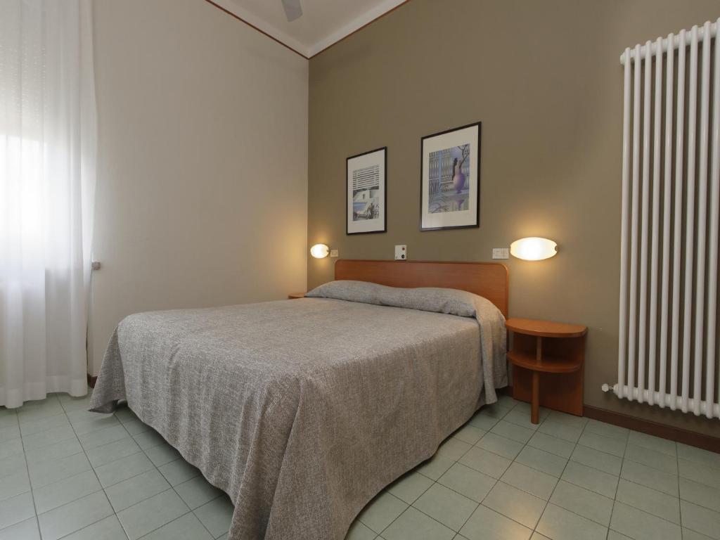 Кровать или кровати в номере Hotel Ravenna