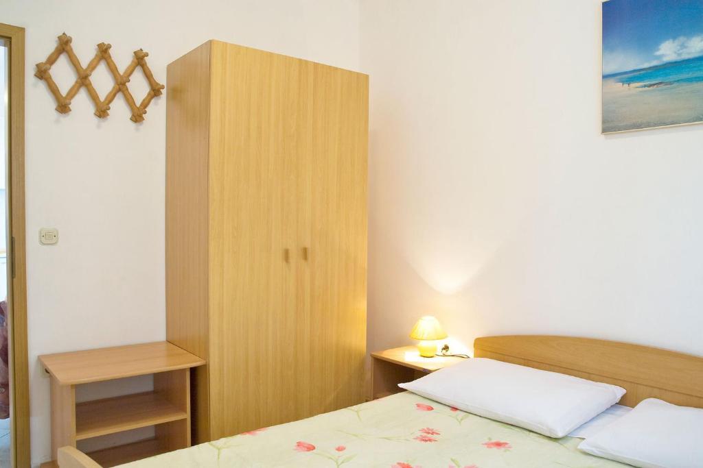 Łóżko lub łóżka w pokoju w obiekcie Apartments Eugen 2024
