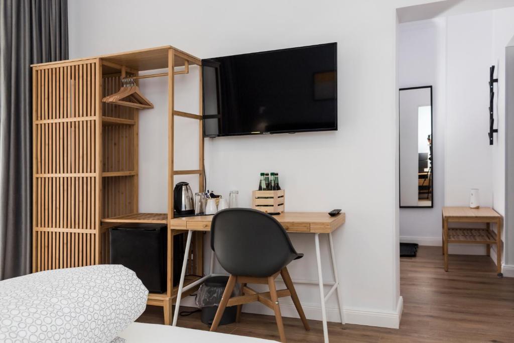 TV a/nebo společenská místnost v ubytování Martin Boutique Hotel