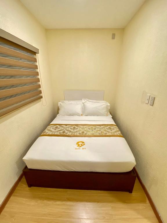 Postel nebo postele na pokoji v ubytování SUN MY HOTEL