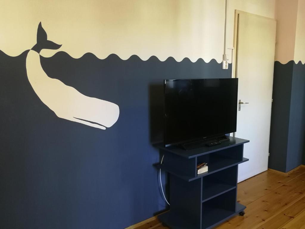 Telewizja i/lub zestaw kina domowego w obiekcie TulipánVendégház