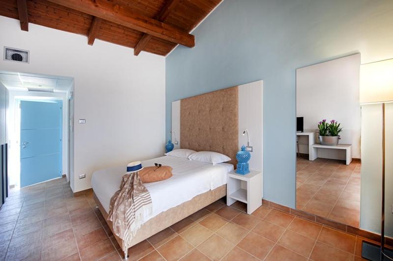Postel nebo postele na pokoji v ubytování Eco Resort Dei Siriti