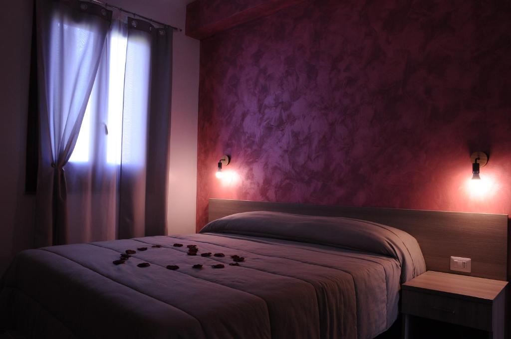 Postel nebo postele na pokoji v ubytování La Fenice