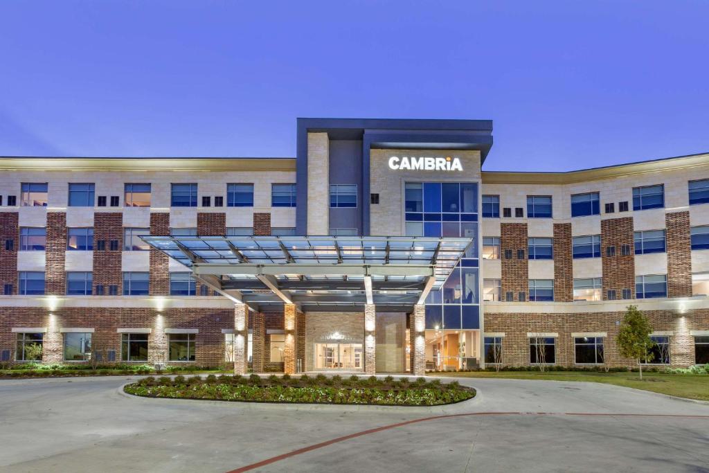 a building with a sign on the front of it at Cambria Hotel Richardson - Dallas in Richardson