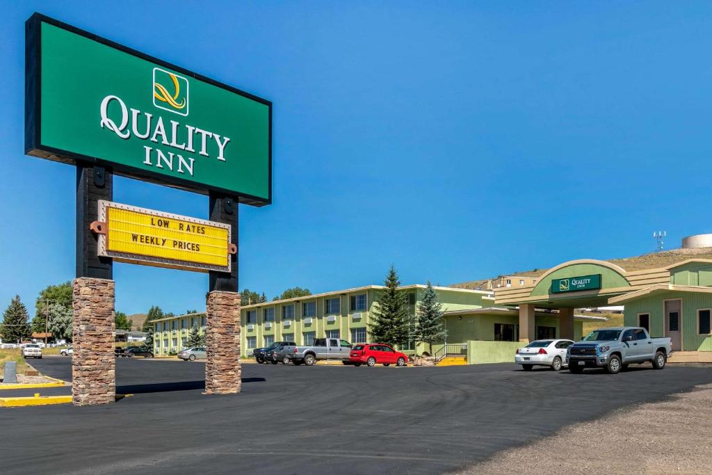 a sign for a quality inn in a parking lot at Quality Inn Rawlins I-80 in Rawlins