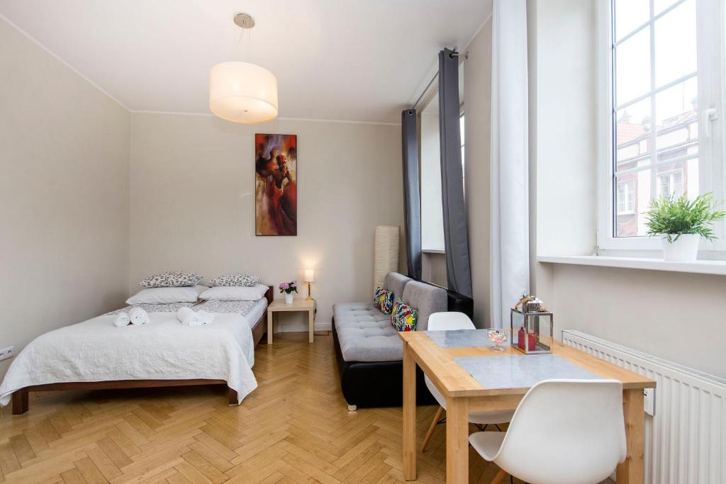 Posteľ alebo postele v izbe v ubytovaní Twój Salon-Apartamenty Stare Miasto