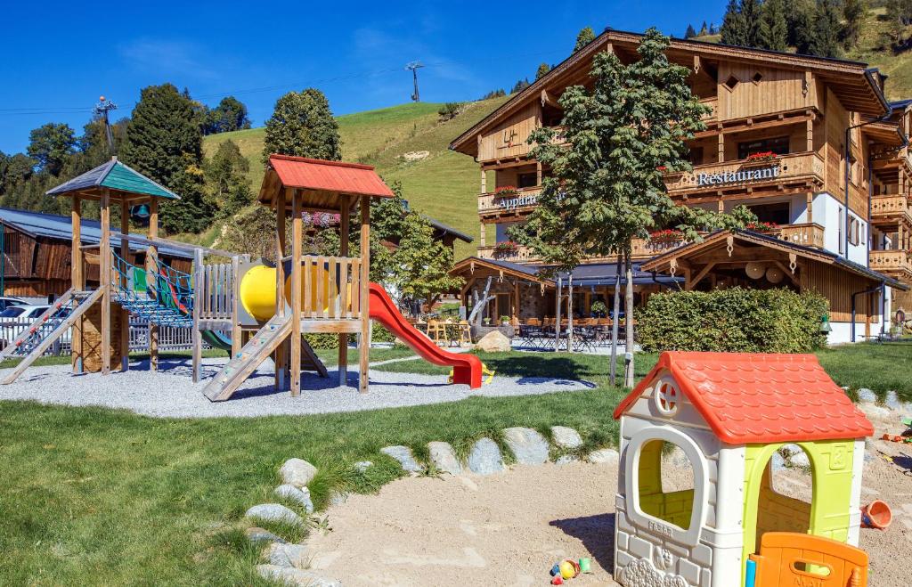 a playground in front of a lodge at Appartements Liebe Heimat in Saalbach-Hinterglemm