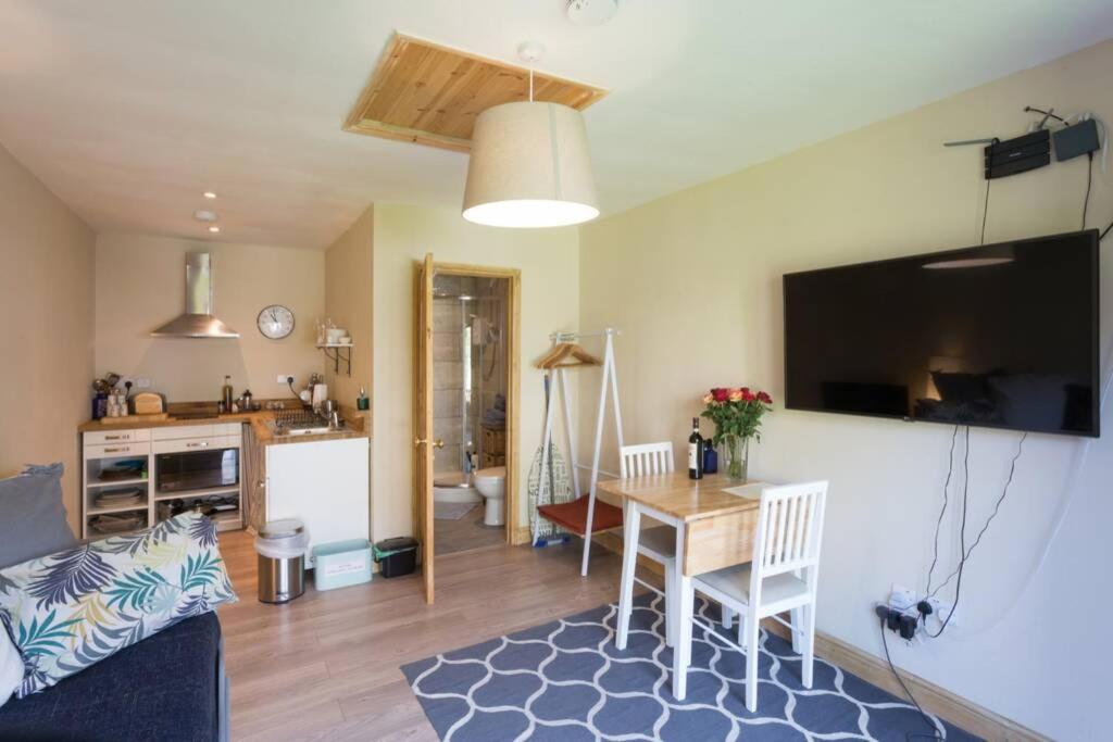 a living room with a kitchen and a dining room at Bristol Little House in Bristol