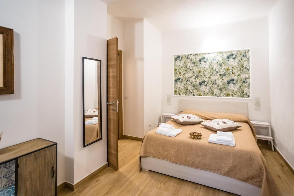 Postel nebo postele na pokoji v ubytování Valle dei Mulini - Apartment