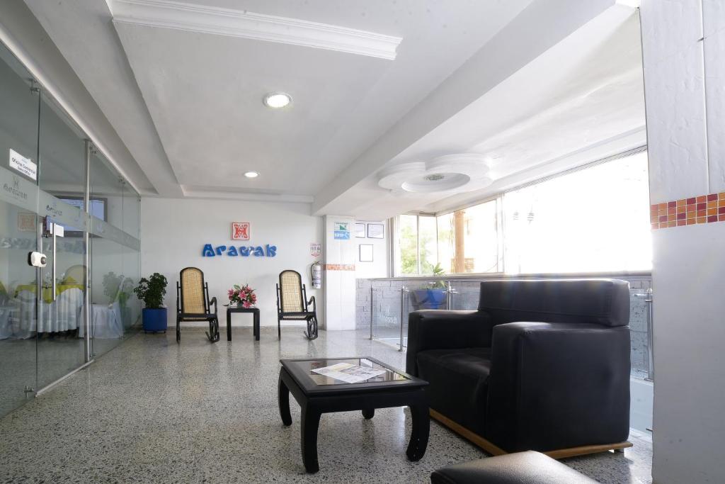 a waiting room with a couch and a table at Hotel Arawak Upar in Valledupar