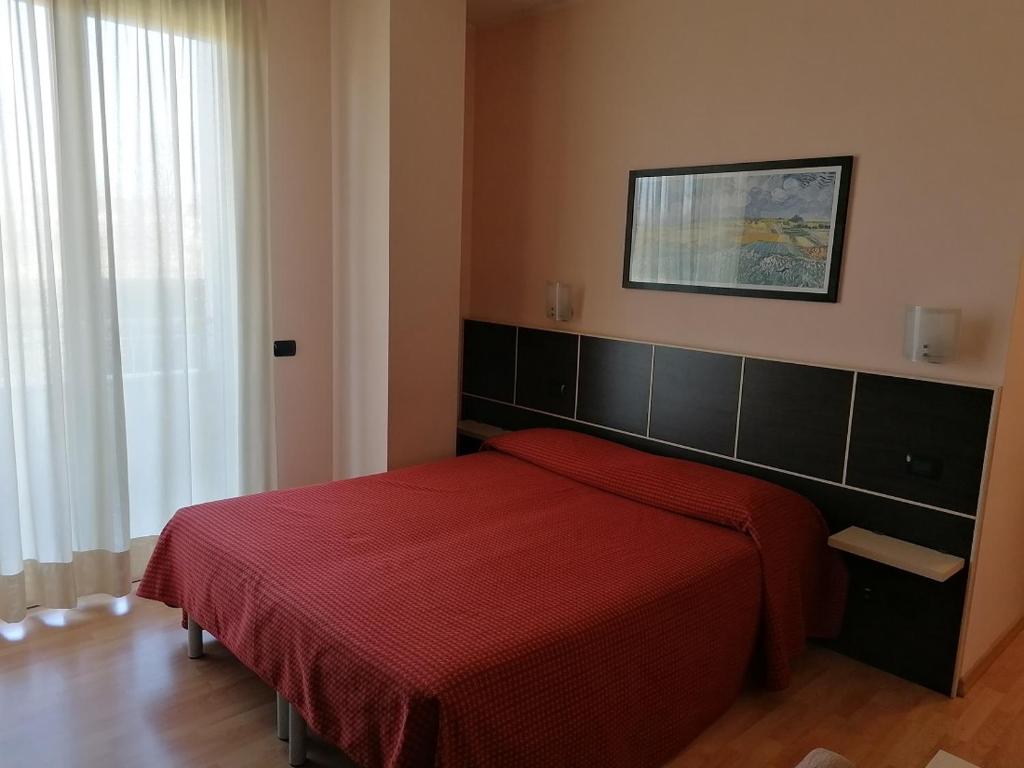 Postel nebo postele na pokoji v ubytování Hotel Residence Zodiaco