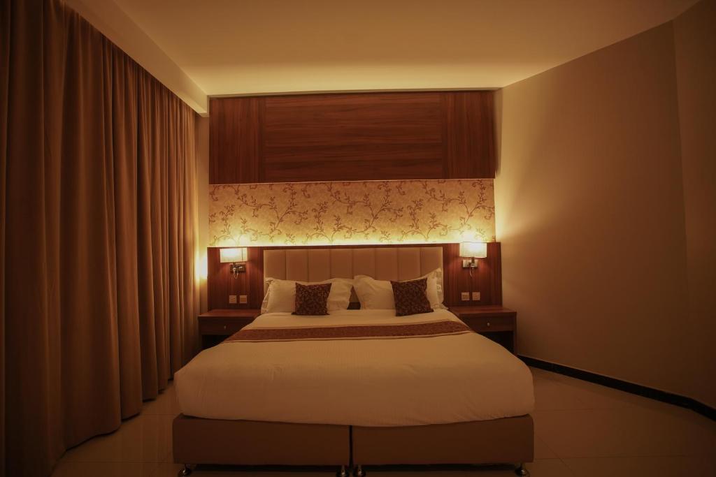 Postel nebo postele na pokoji v ubytování Kayan Al Taif Hotel