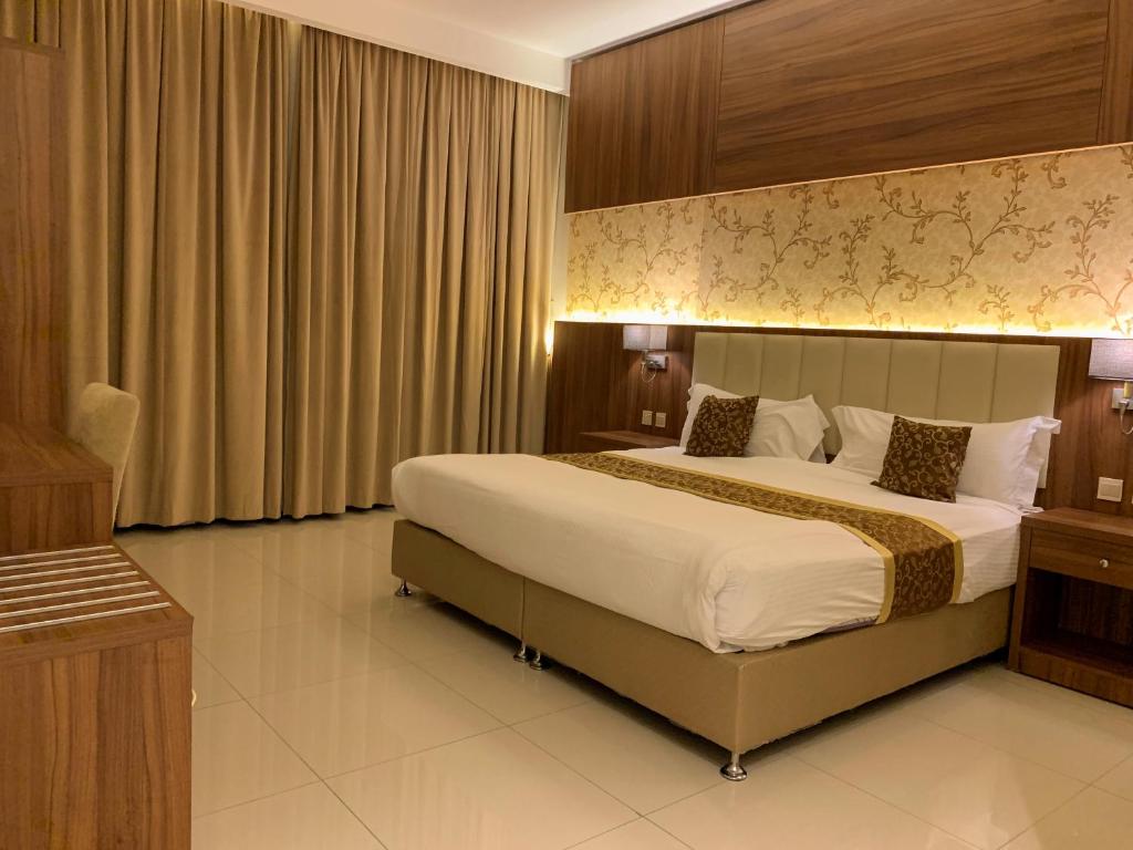 Postel nebo postele na pokoji v ubytování Kayan Al Taif Hotel