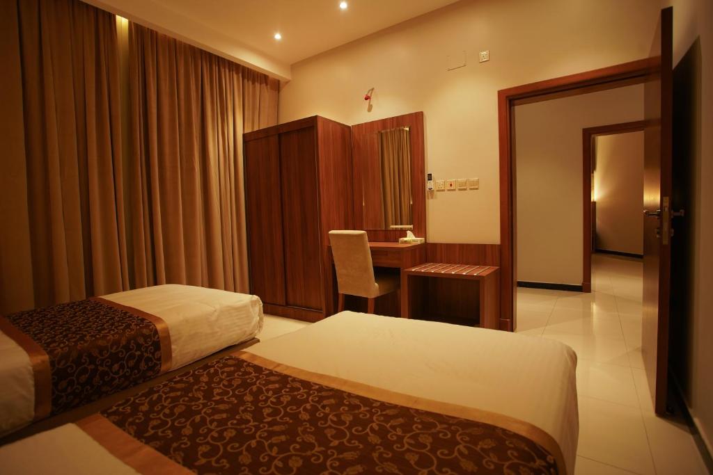 Postel nebo postele na pokoji v ubytování Kayan Al Taif Hotel