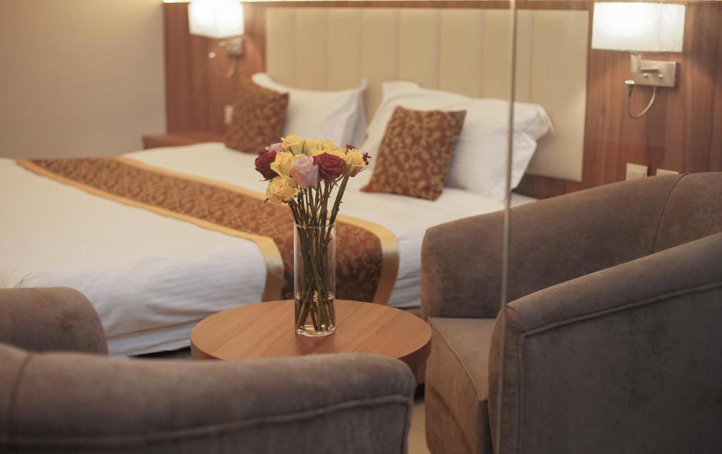 Postel nebo postele na pokoji v ubytování Kayan Al Taif Hotel