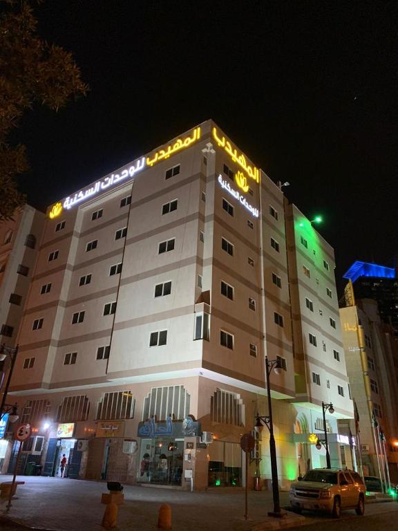 a large building with lights on top of it at Al Muhaidb Al Diwan - Al Olaya - Economic in Riyadh