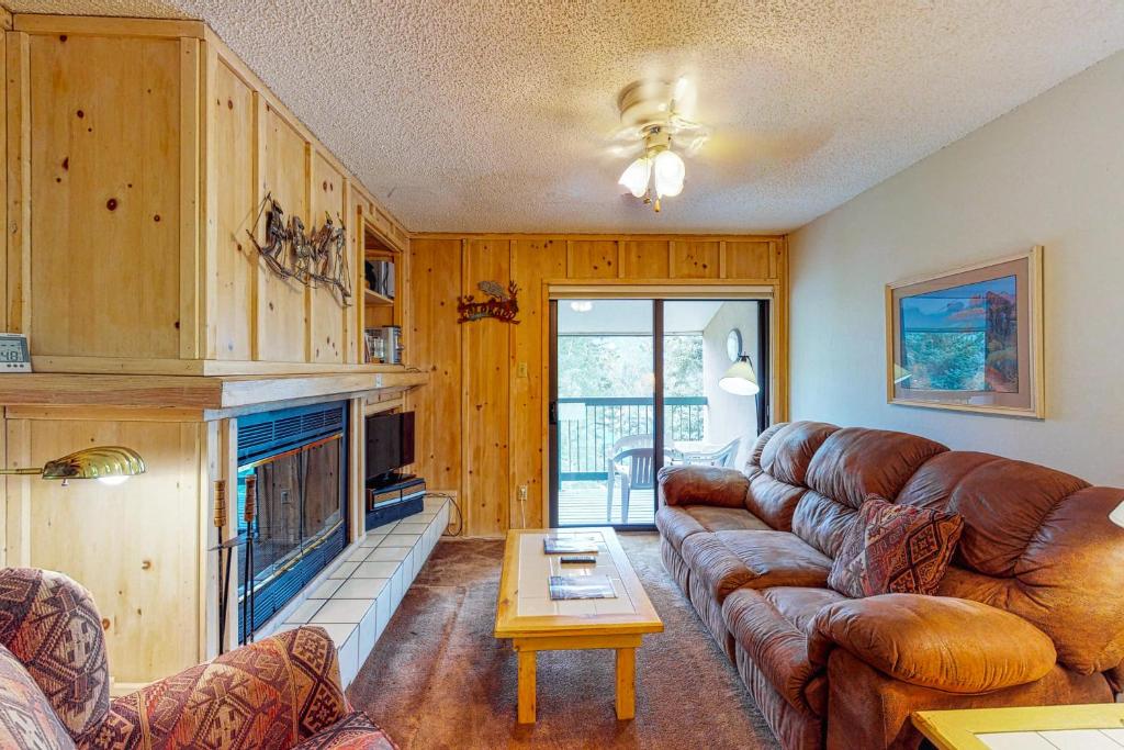 a living room with a couch and a fireplace at Angelhaus #300 in Durango Mountain Resort