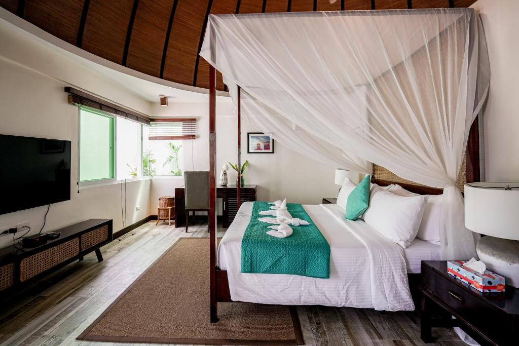 Postel nebo postele na pokoji v ubytování Weekends El Nido Beach Resort
