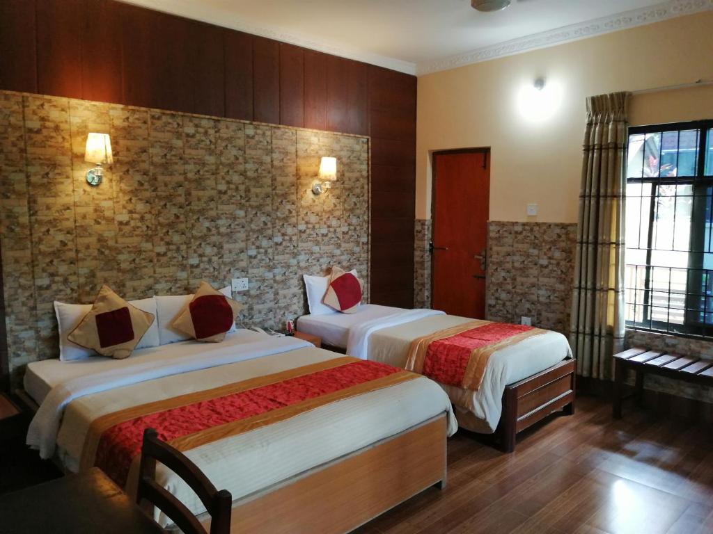Postel nebo postele na pokoji v ubytování Hotel Wildlife Camp